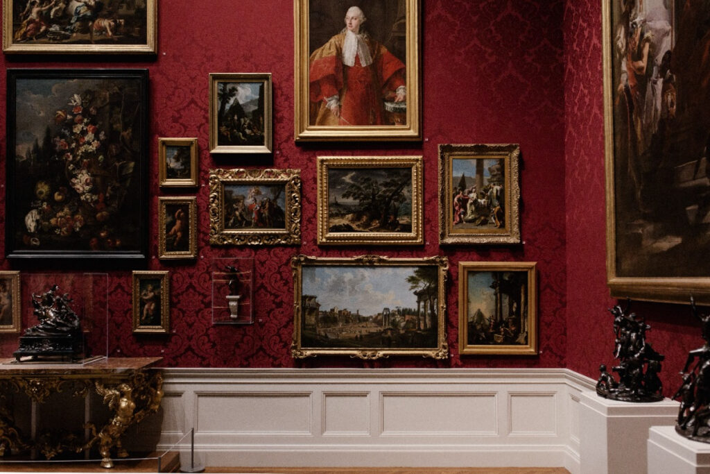 Classically framed artworks in a gallery